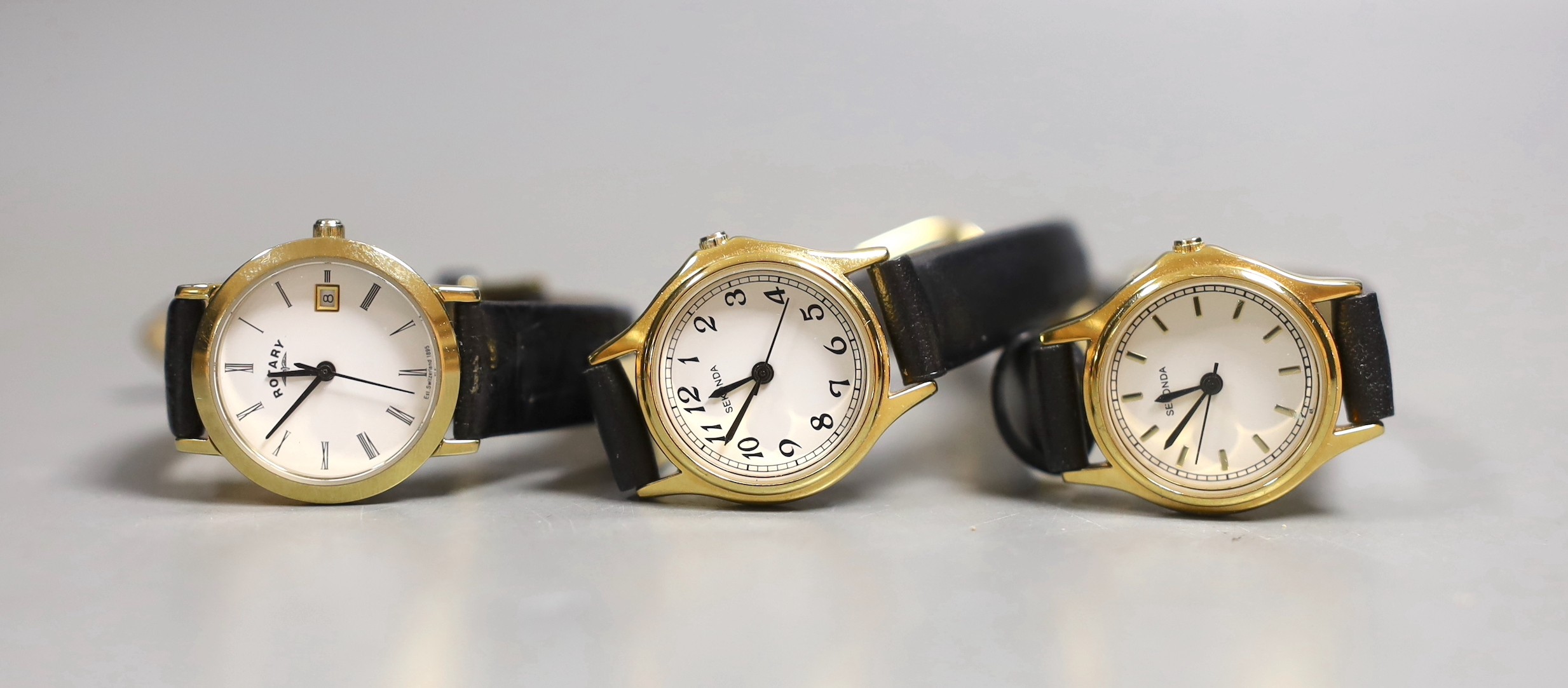 Six various lady's wrist watches, with quartz and other movements, including Sekonda and Rotary and a pair of simulated pearl earrings.